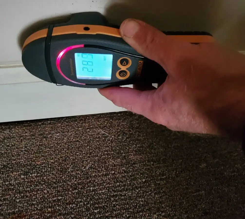 Moisture detection at baseboard during Storm Damage Restoration in East Hanover